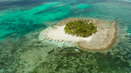 Tropical Guyam Island with a Sandy Beach and Tourists