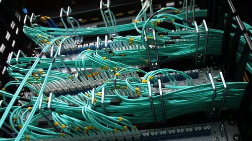 Bottom View Thin Green Cables Connected to Mining Server