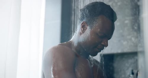 Man Cleansing Under Refreshing Shower Water