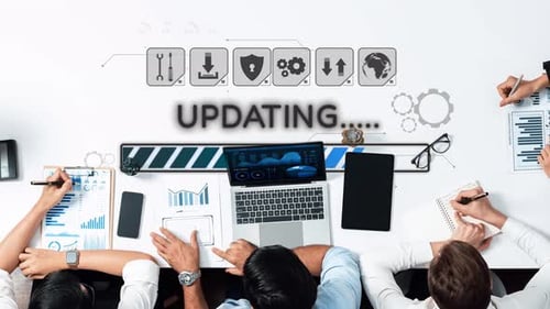 Collaborative Business Meeting on Digital Updates Featuring Progress Bar and Graphs for Growth Analy