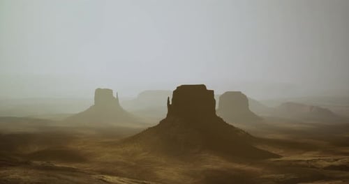 Dusk Illuminates Unique Rock Formations in Monument Valleys Landscape