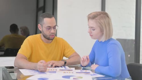 Creative People Working on Documents in Office