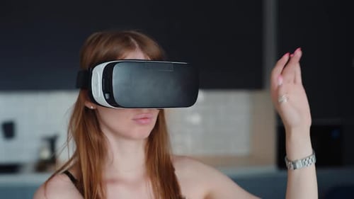 Woman Using VR Headset in Modern Home
