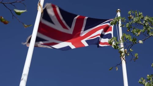Tattered Union Jack Flag Waving in the Wind