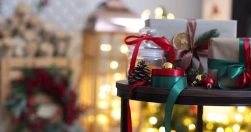 Christmas Presents With Decorative Ribbons Around A Fireplace