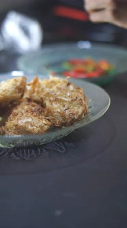 Delicious Golden-Brown Fritters on a Plate at Home