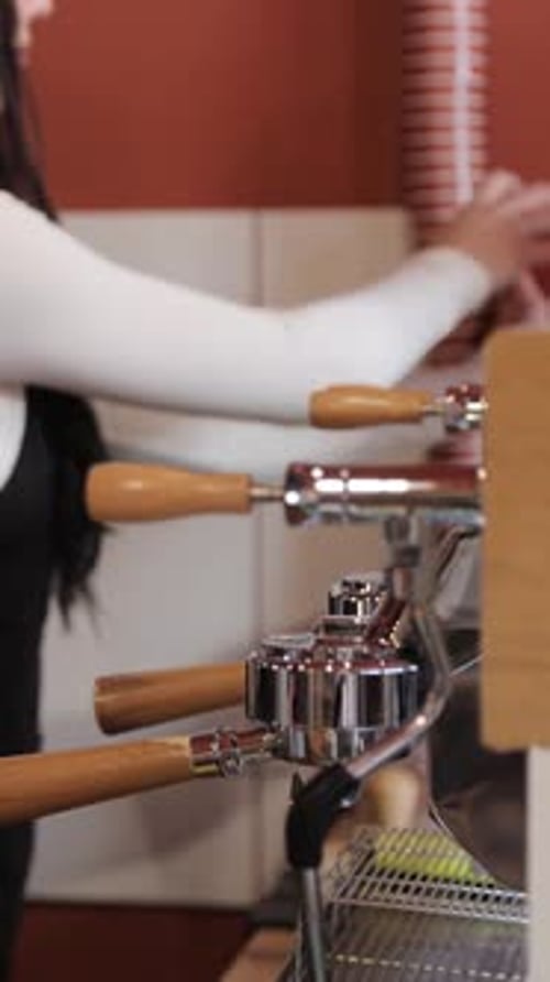 Barista Preparing Espresso Drink in Coffee Shop
