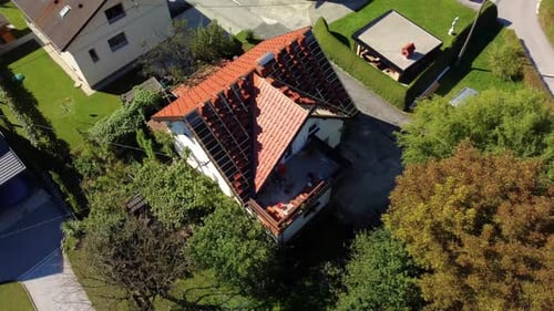 Roof repair aerial clips. Repairing damaged roofing materials that require replacement with fresh on
