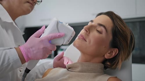 Woman Receives Facial Treatment at Modern Clinic
