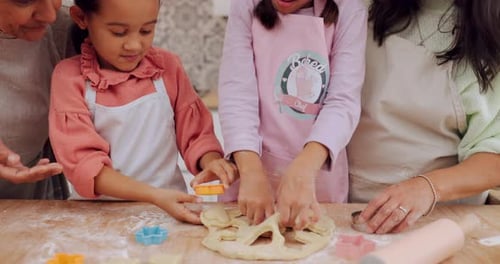 Girls and Adults Baking Cookies Together at Home