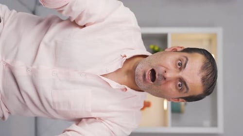 Vertical video of Man getting angry at camera.
