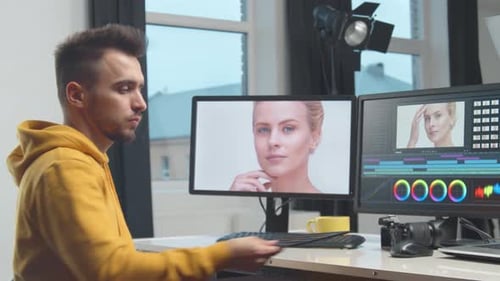 Freelance Videographer Colorist Editing Footage Using Professional Software Monitor and Montage