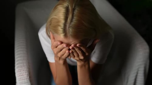 Closeup High Angle View Face of Stressed Young Woman Thinking Problems Suffering From Depression