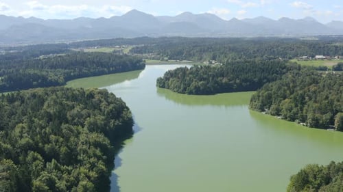 Scenic and beautiful aerial drone landscape over green coloured lake