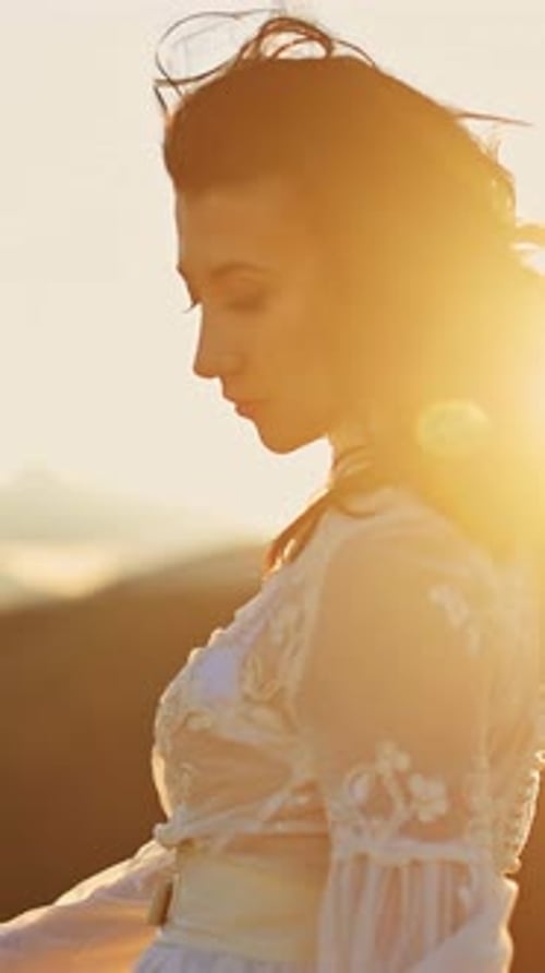 Woman in Dress Poses in Sunrise Golden Hour