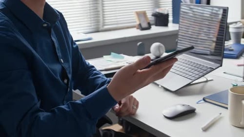 Man Recording Voice Message on Phone Talking Business while Working at Office
