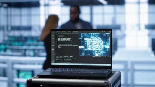 Focus on Notebook Used By Engineers in Server Hub in Blurry Background