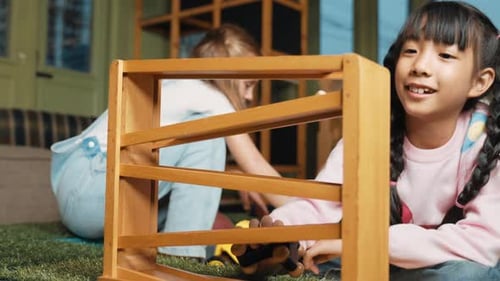 Children Playing with Wooden Toy Car Roller Coaster