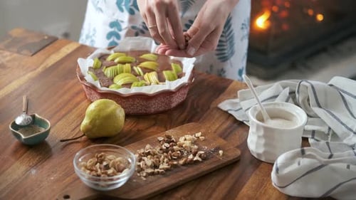 Woman Baking Pear Cake in Cozy Kitchen
