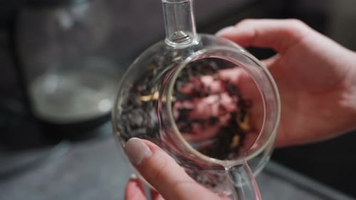 Artist Crafts Herbal Infusion Meticulously Close View Capturing Artisan Skillfully Placing Dried