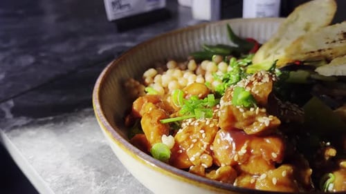 Close-up of fresh chicken and bean salad bowl