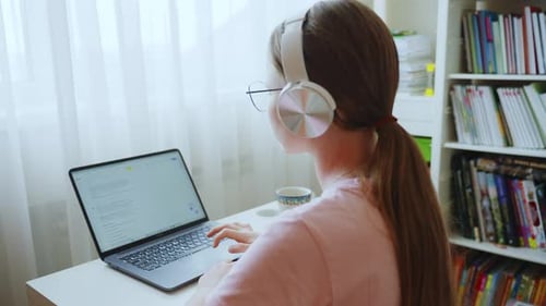 Teen Girl Working on Laptop at Desk