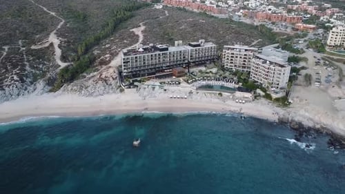 Aerial shot from a beautiful hotel overlooking the multi-story building, swimming pools and vacation