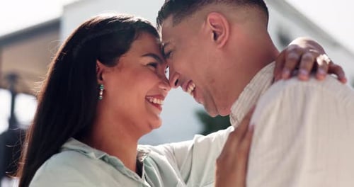 Affectionate Couple Embracing Outdoors in the Sunlight