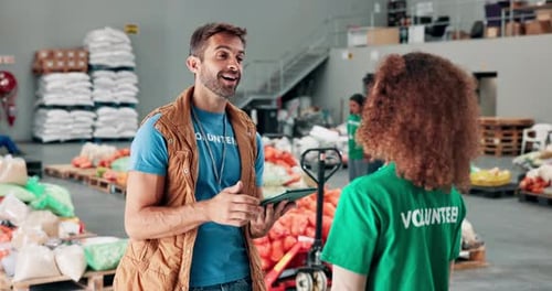 Volunteers Working Together in Warehouse