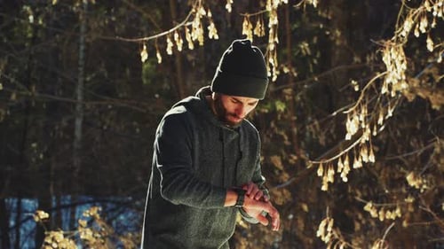 Man Runs Through the Winter Forest