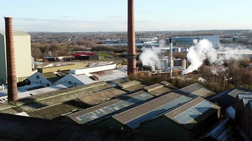 Pilkington glass factory warehouse buildings aerial view across industrial town refinery