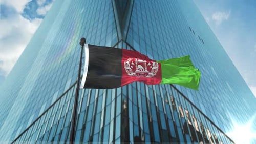 Waving Afghanistan Flag on Modern Corporate Building