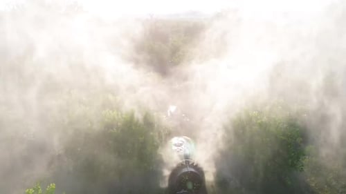 Tractor spraying pesticide drone aerial view, pesticides or insecticide spray on lettuce or iceberg