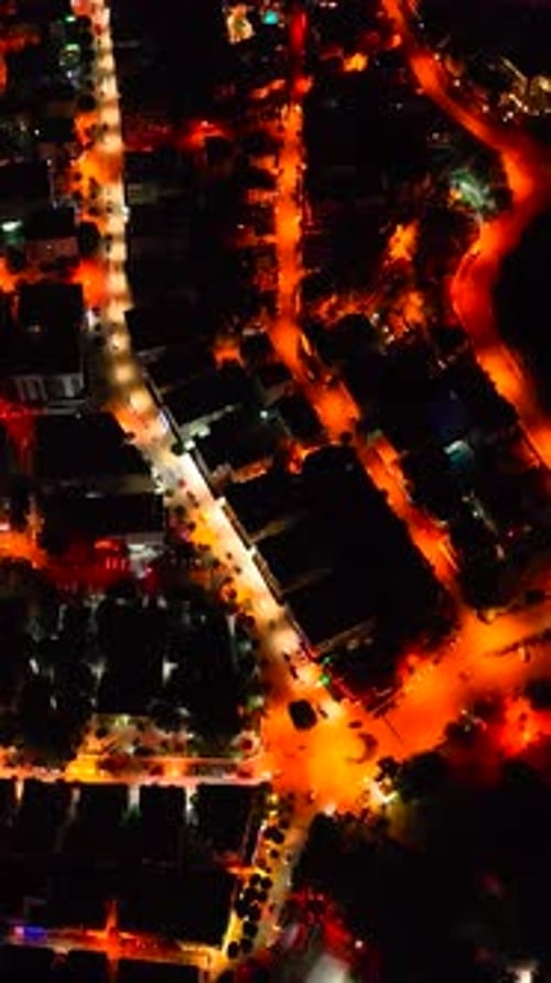 Aerial View of Coastal City Lights at Night