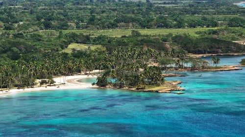 Aerial establishing overview of turquoise clear blue water and tropical coastline of Samana bay Domi