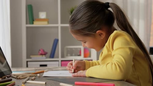 Young Girl Drawing with Tablet for Reference
