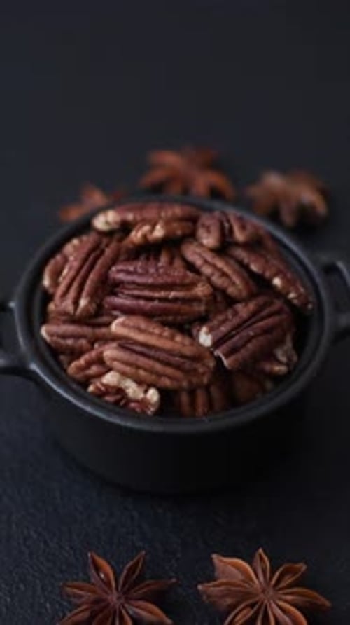 Peeled and roasted pecan nut as an ingredient for healthy food. Pecan nut as a food background