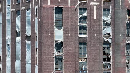 Aerial Rising View of decommissioned Coal Power Plant with Shattered Windows