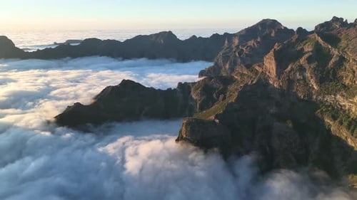 Aerial view of mountains rising above clouds, Portugal.