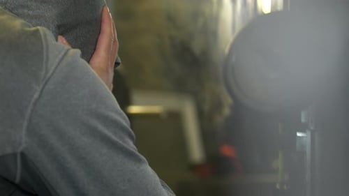 Depressed man having nervous breakdown at the gym, dolly shot