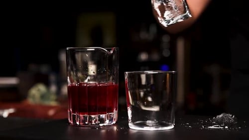 the bartender prepares a cocktail at the bar