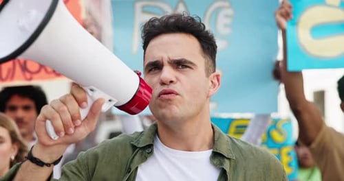 Young Adult Shouting into Megaphone at Protest