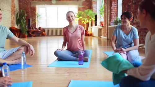 Fitness, Sport and Healthy Lifestyle Concept - Group of People in Yoga