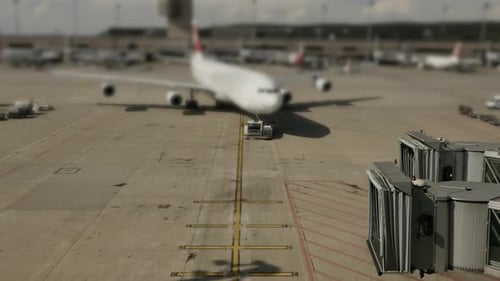 Commercial Airplane Landing at Airport Terminal Runway After Flight