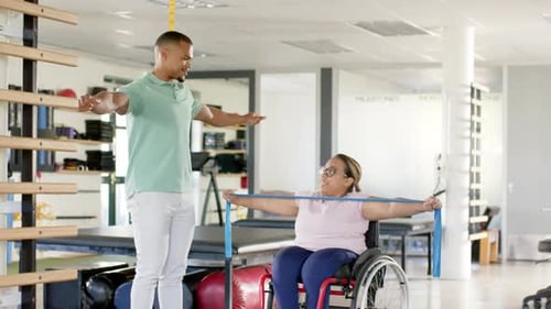 Patient Exercises with Therapist and Resistance Band