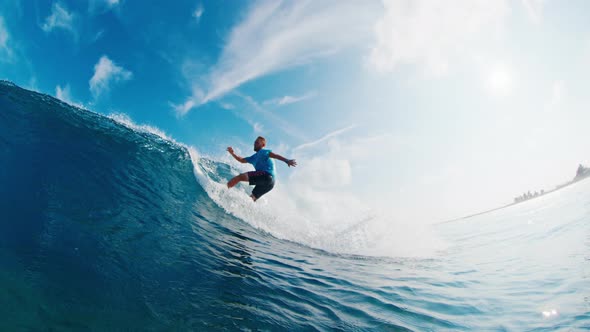 Professional surfer rides the wave and makes aggressive turn, People ...