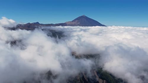 Aerial of Teide National Park and Volcano Mount Teide Above White Clouds