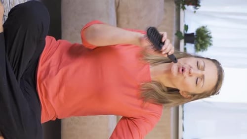 Vertical video of The woman is singing.