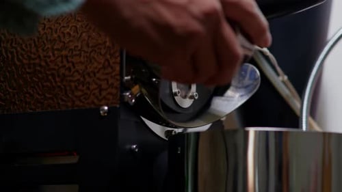 Closeup macro of pour coffee green beans into coffee roaster for each level coffee beans roasted