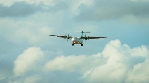 Airplane Coming in for Landing on Cloudy Day